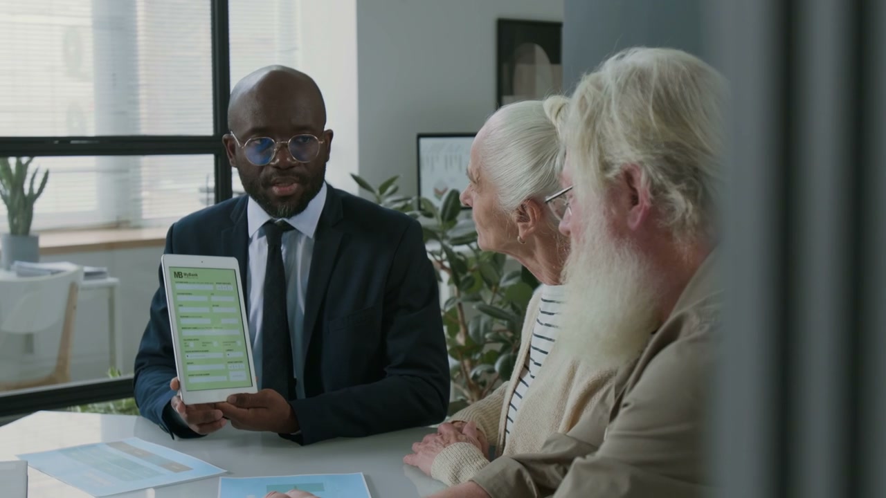 Financial Advisor Explaining to Senior Couple
