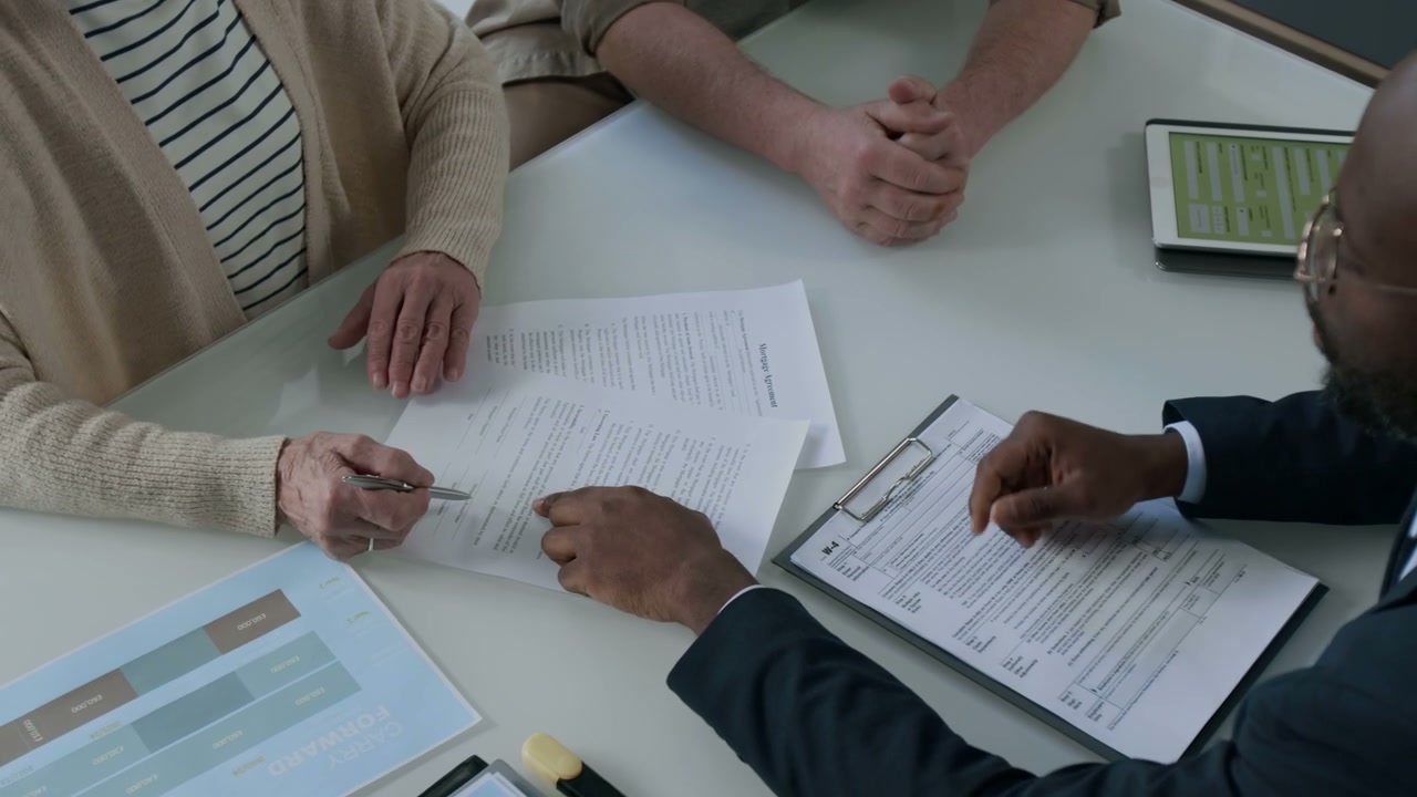 Senior Client Signing Document with Advisor