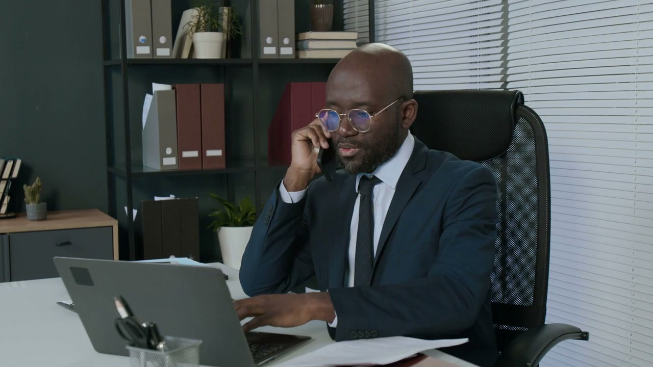 Black Businessman on Phone Call in Office