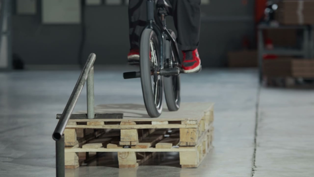 BMX Rider Performing Trick on Rail