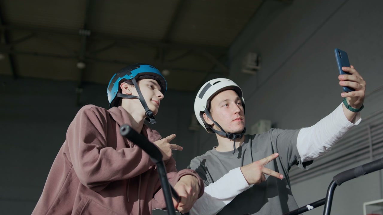 BMX Riders Taking Selfie in a Hangar