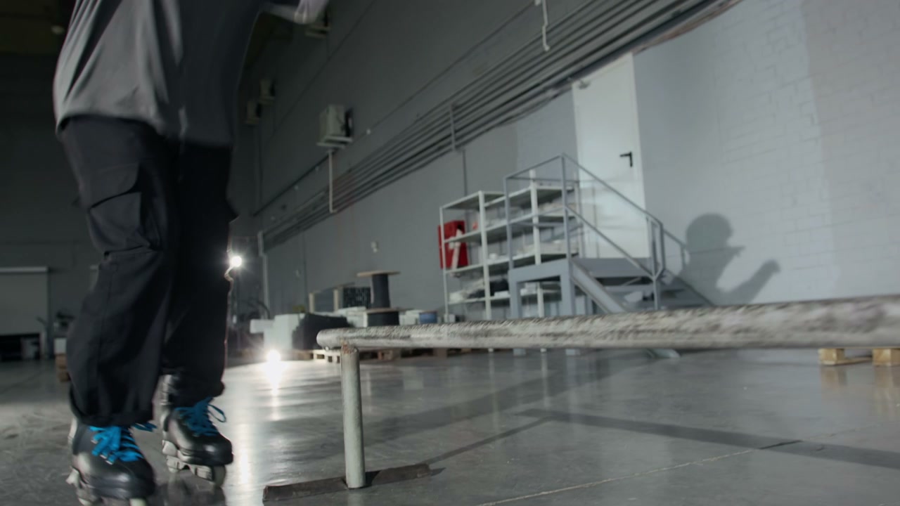Rollerblader Grinding Rail Indoors