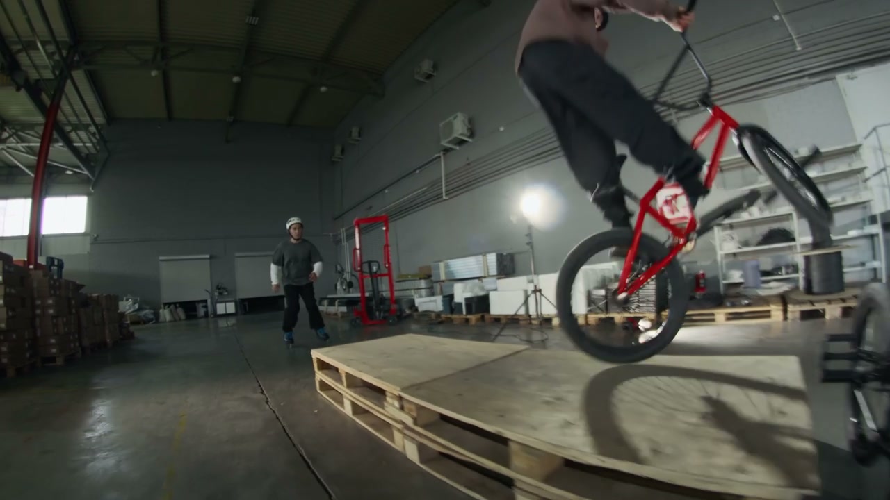 BMX Rider and Skater Perform Freestyle Tricks