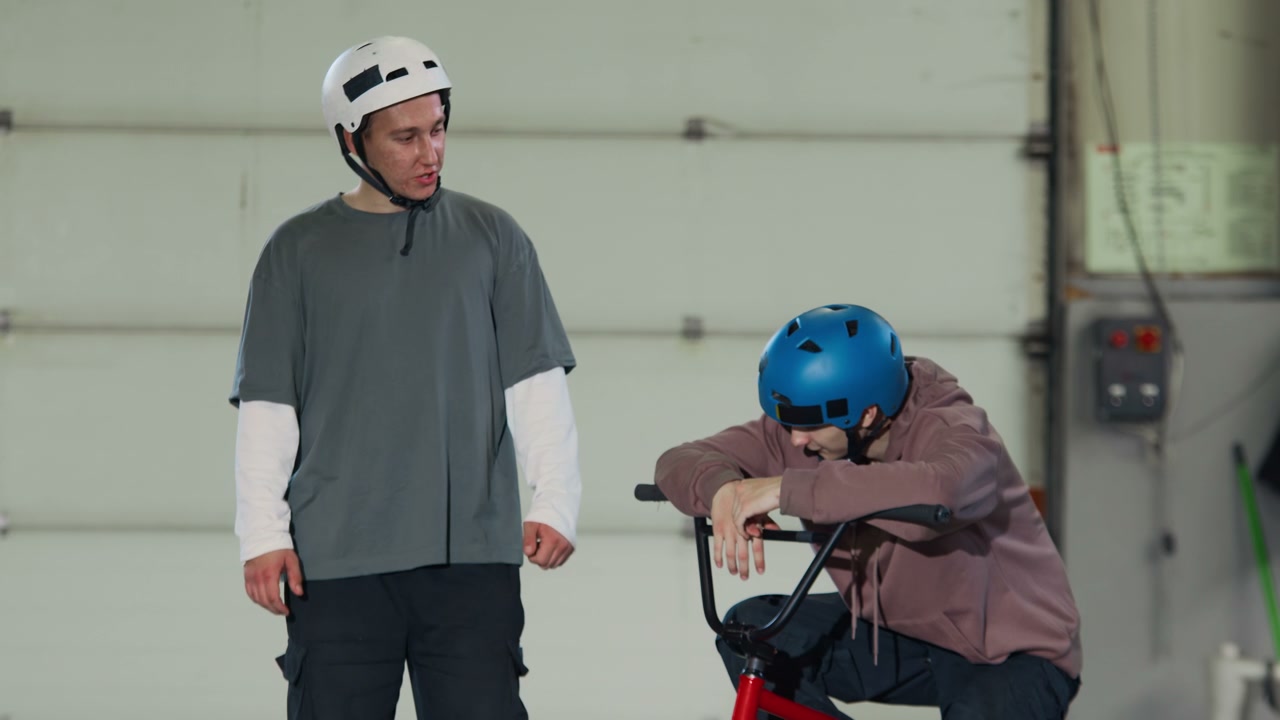 BMX Riders Posing in Warehouse