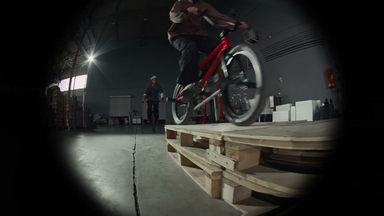 Fisheye View of BMX Rider in Warehouse