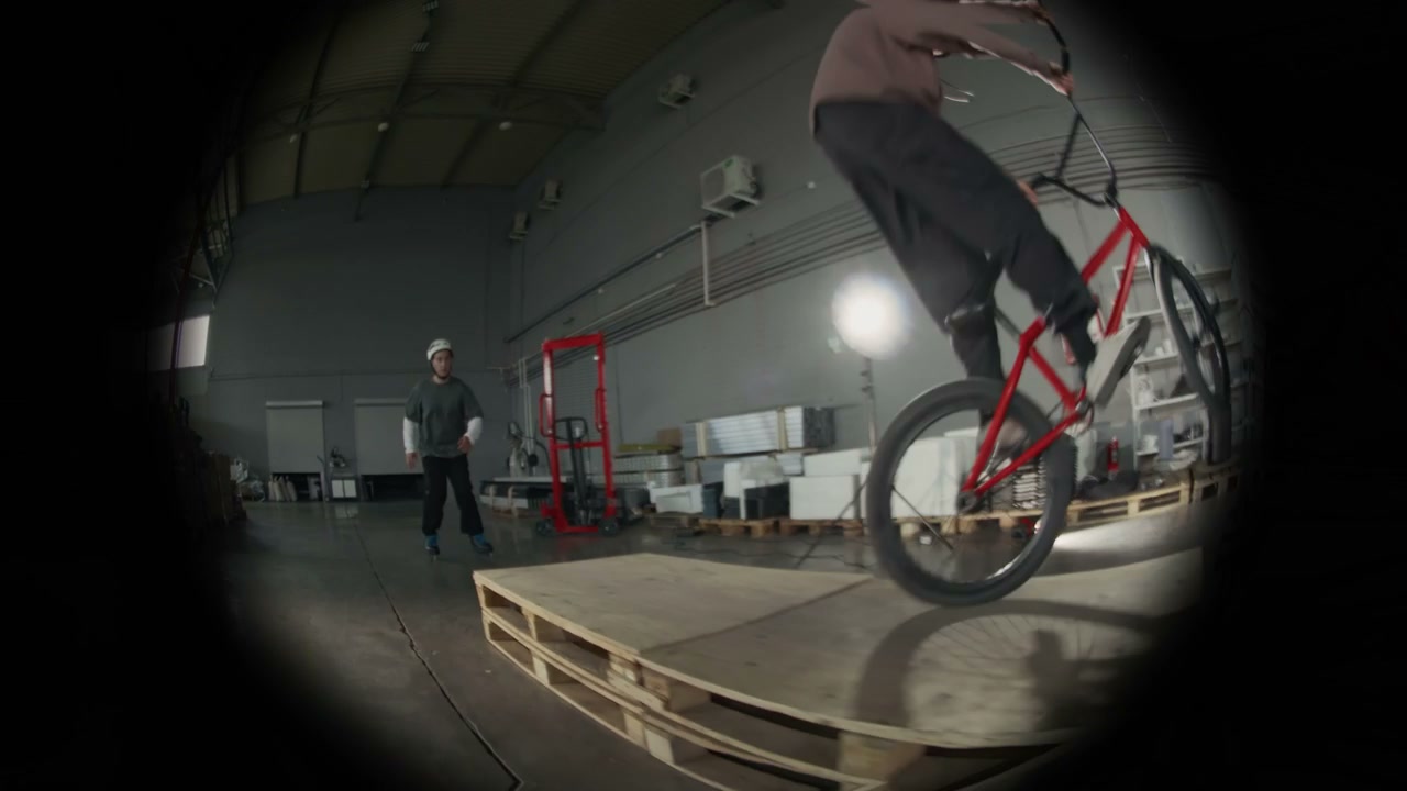 BMX Rider and Skater Performing Stunts