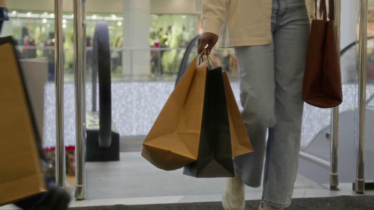 Couple with Shopping Bags in Mall