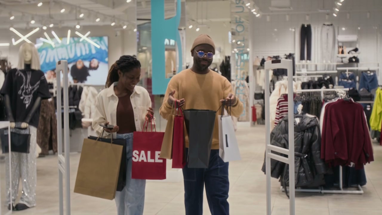 Happy Couple Shopping with Sale Bags in Mall