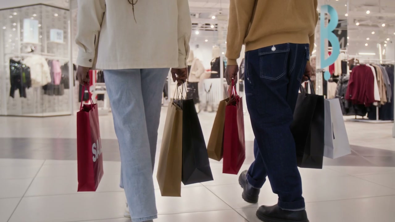 Couple Walking with Shopping Bags