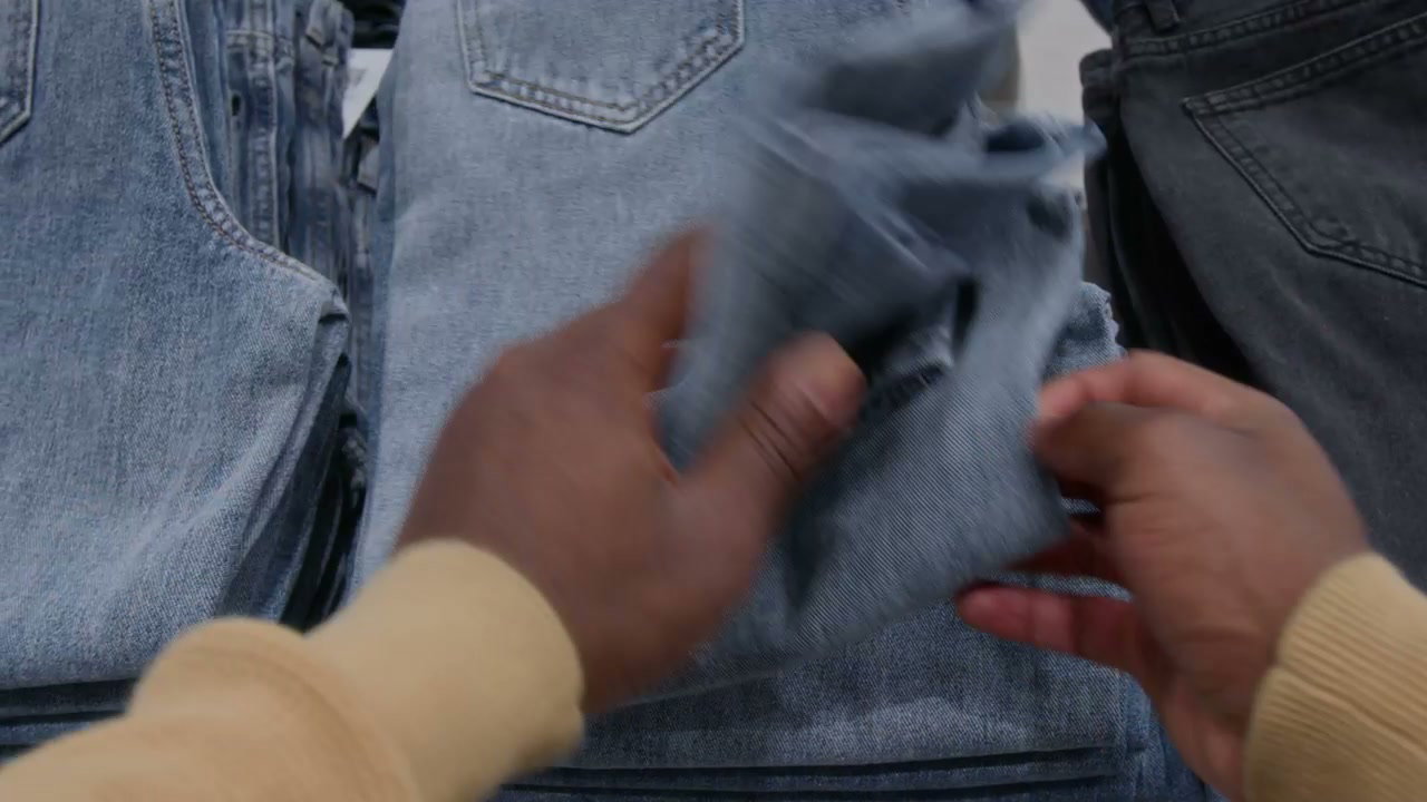 POV Hands Shopping for Denim Jeans