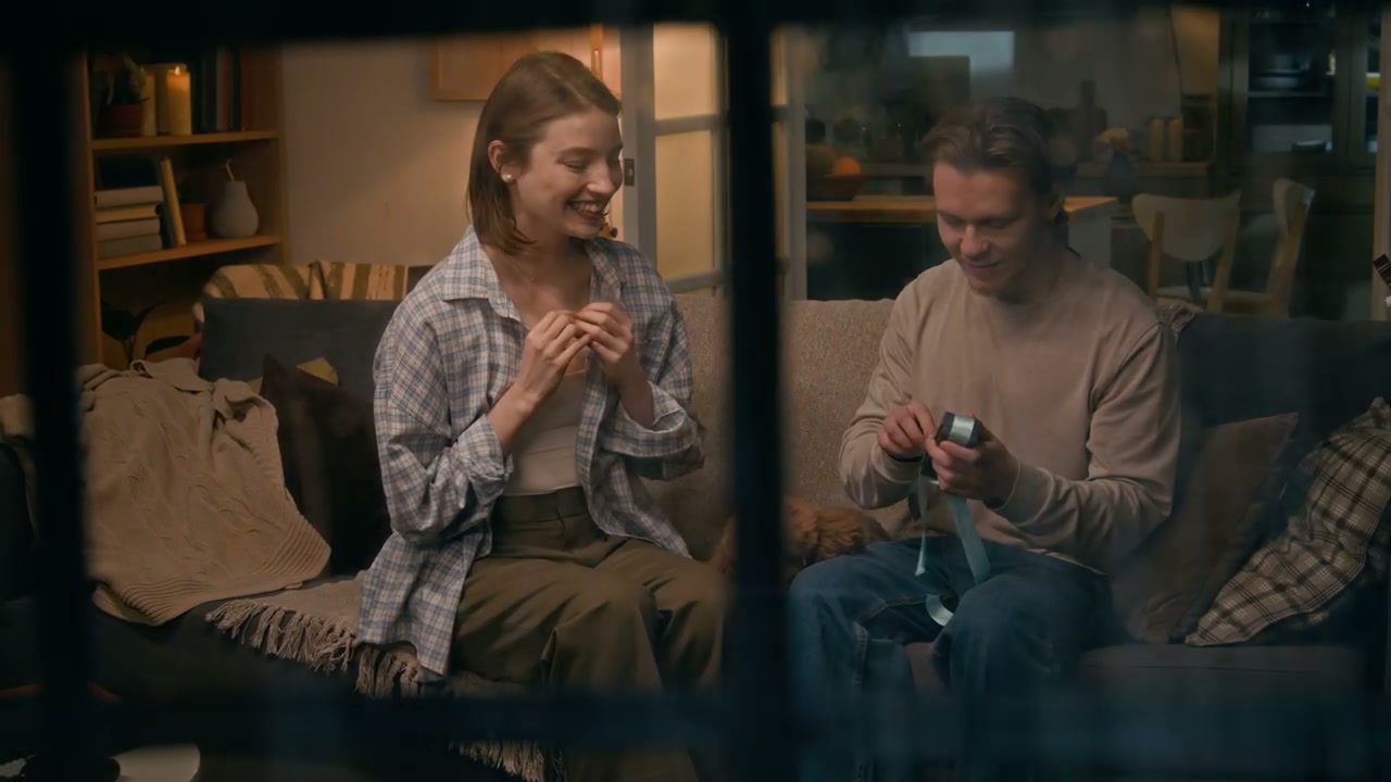 Couple Unwraps Pregnancy Test Gift Through Window