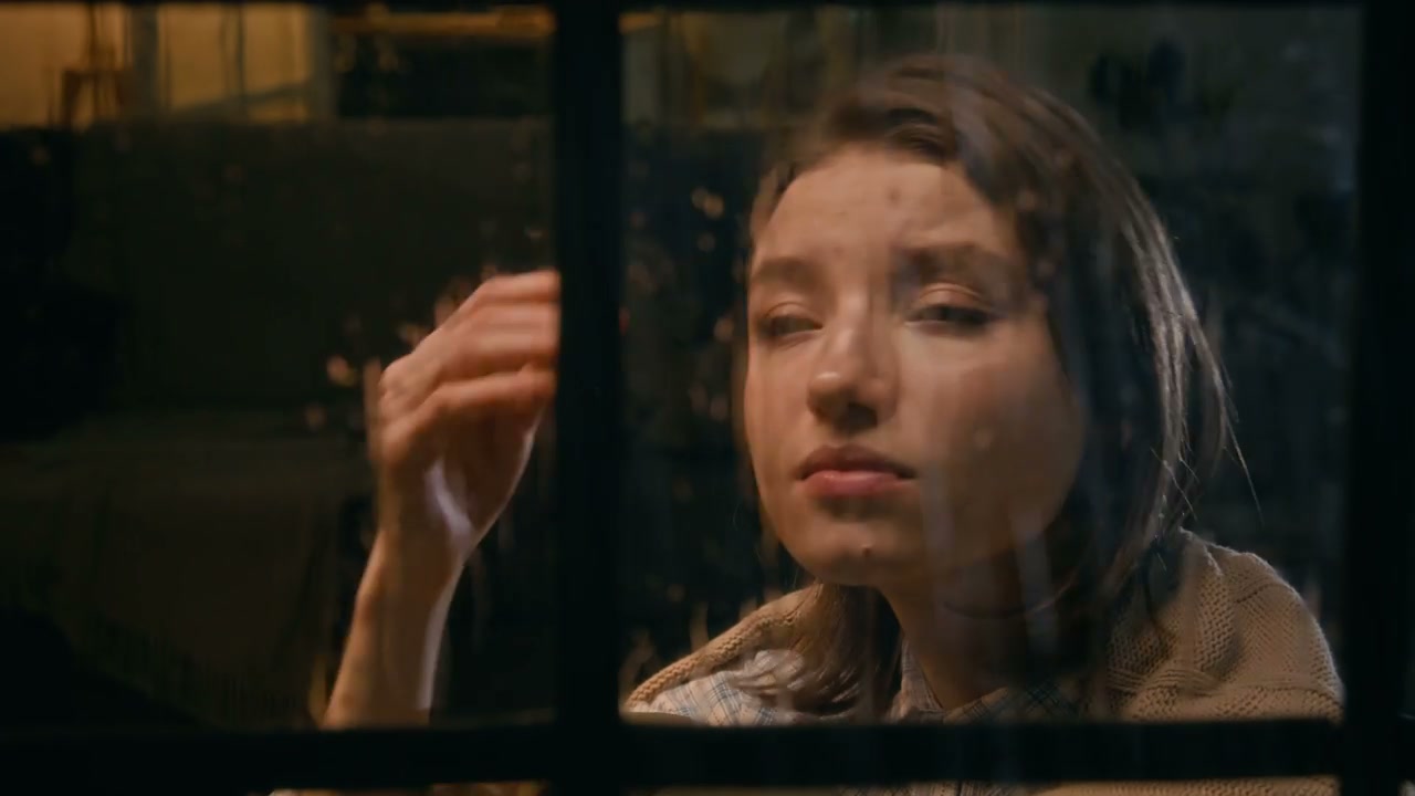 Melancholy Woman Looking Out Window
