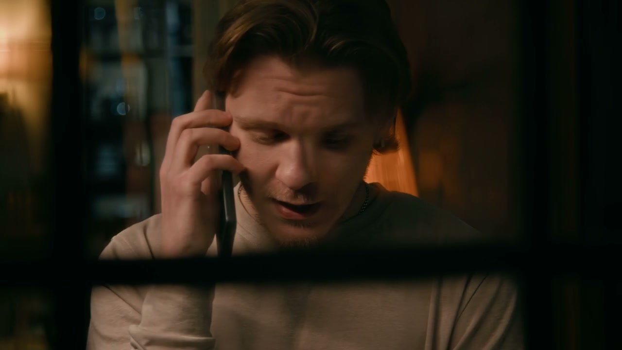Angry Man on Phone Call Through Window