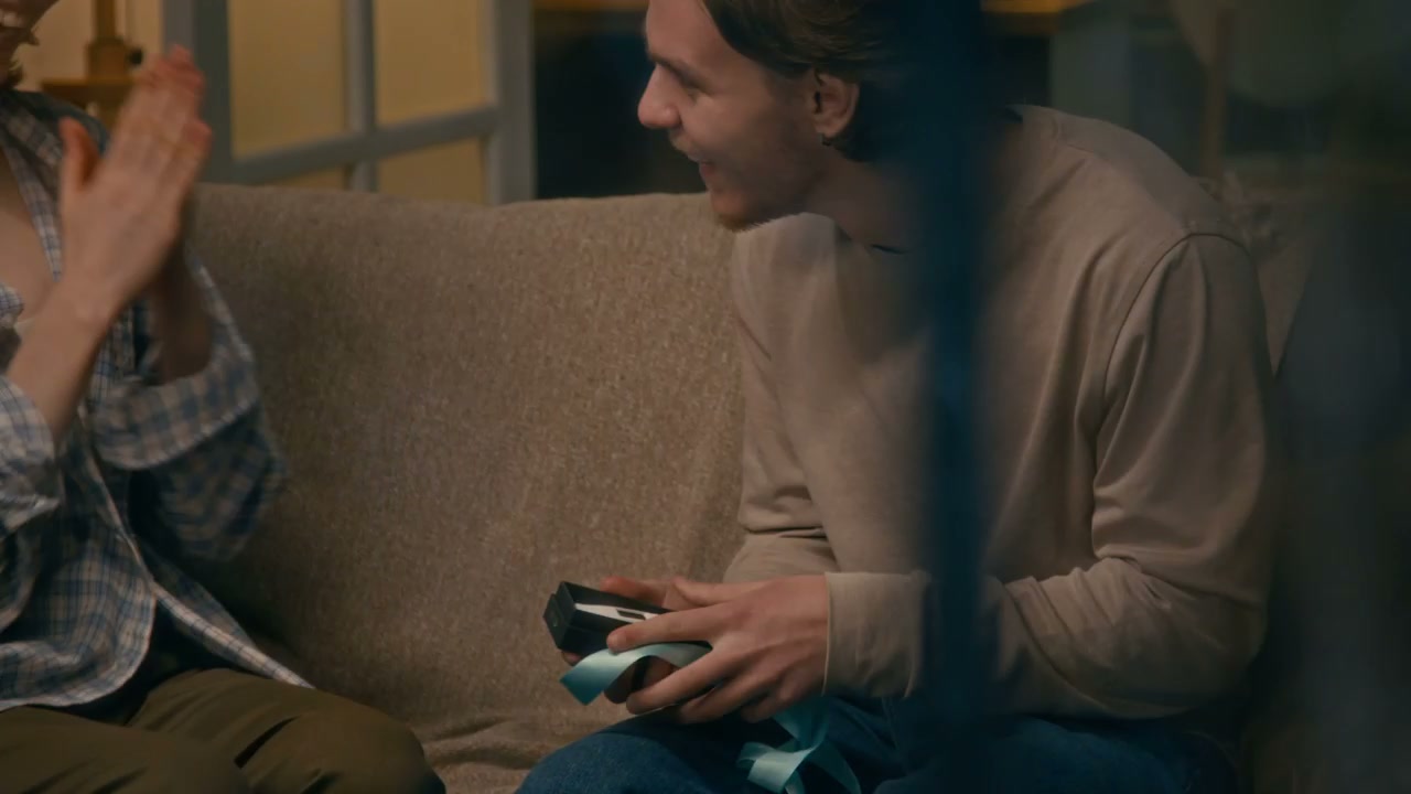 Couple Reacts to Pregnancy News Gift