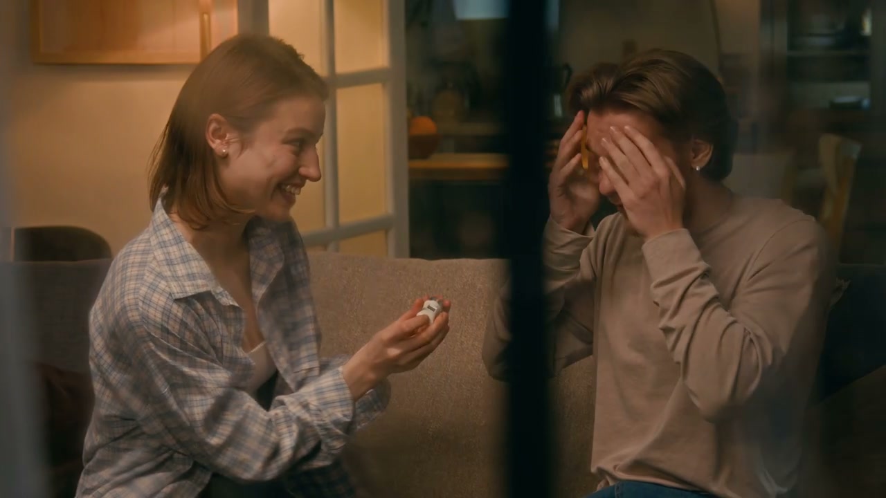 Couple Reacting to Positive Pregnancy Test