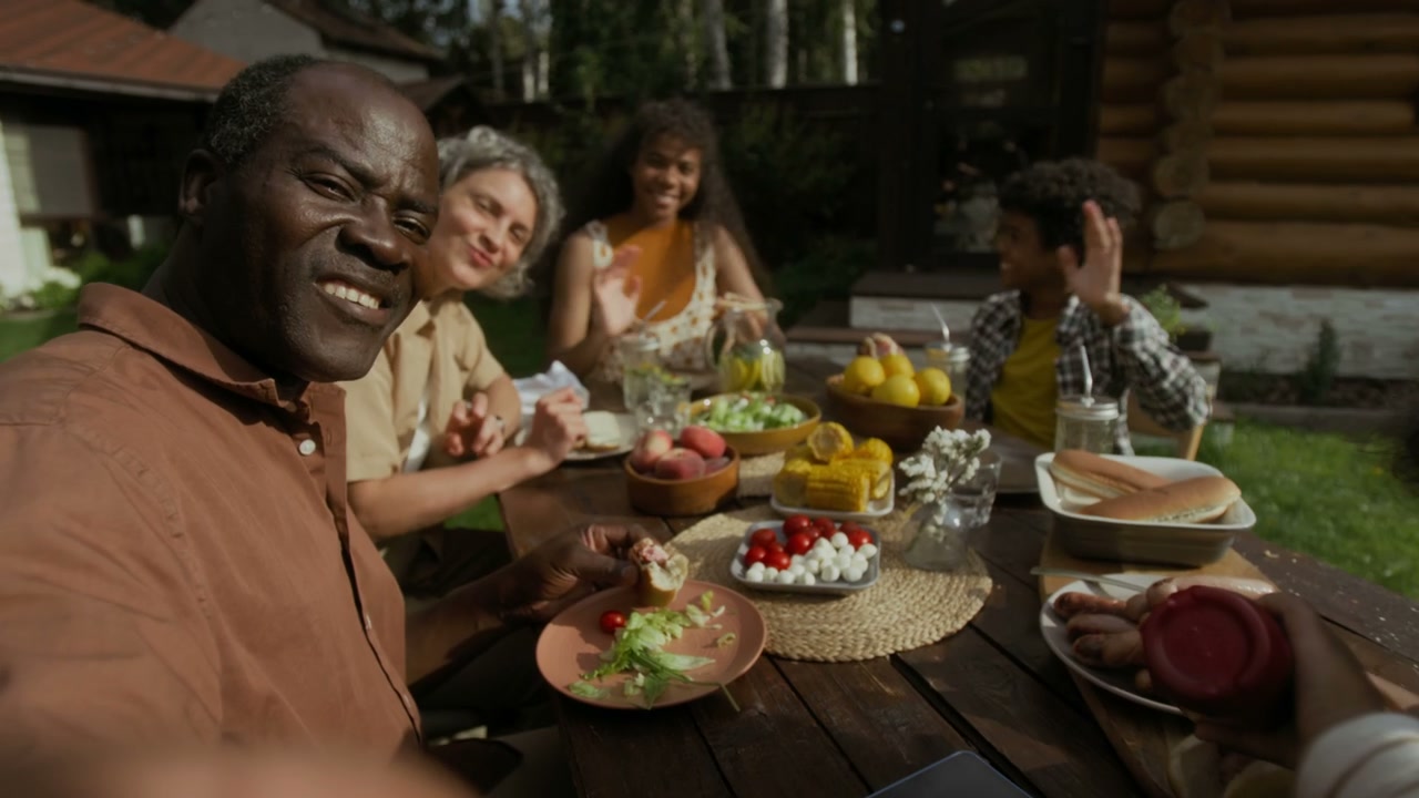 Happy Multiethnic Family Eating Outdoors