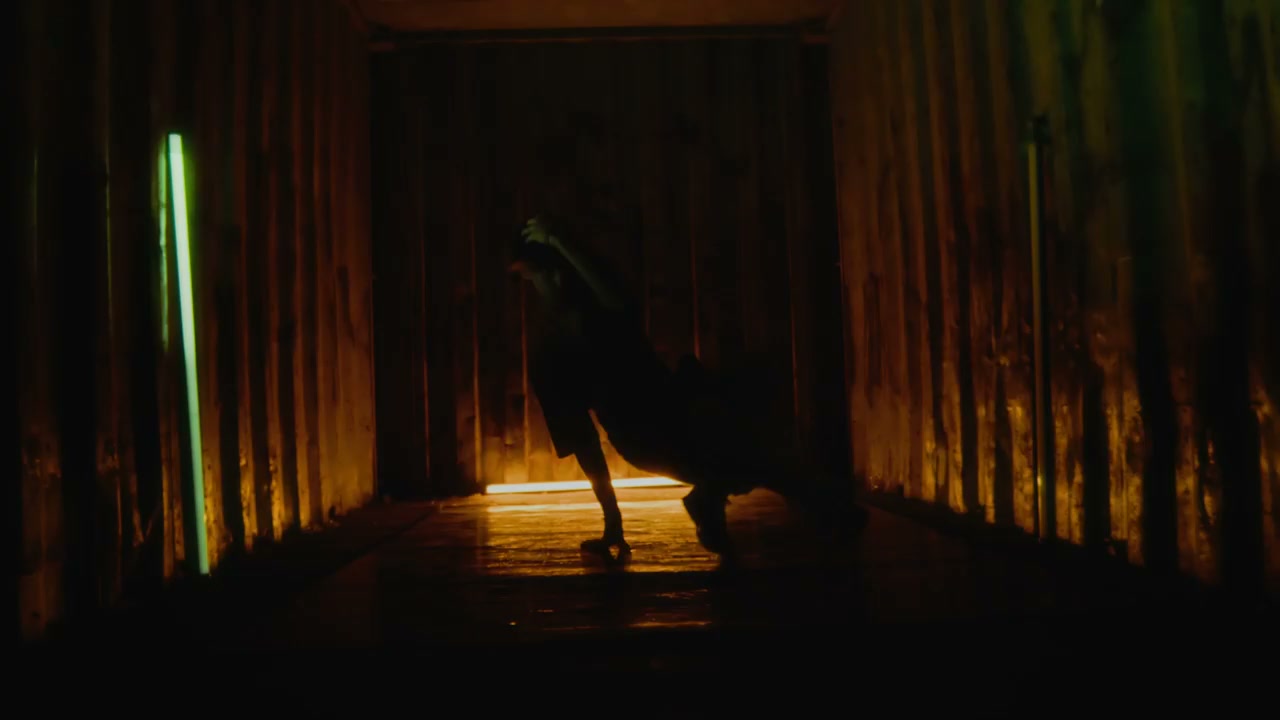 Breakdancer in Neon Lit Corridor