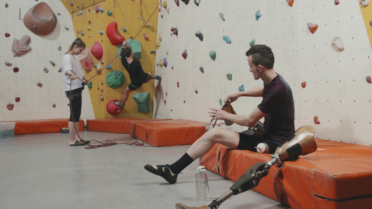 Man with Prosthetic Leg Prepares for Climbing