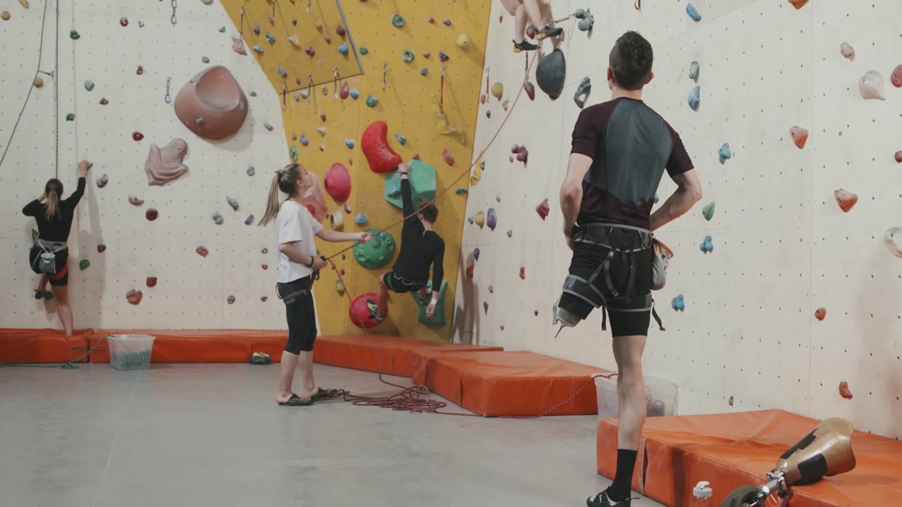 Man with Prosthetic Leg at Indoor Climbing Gym
