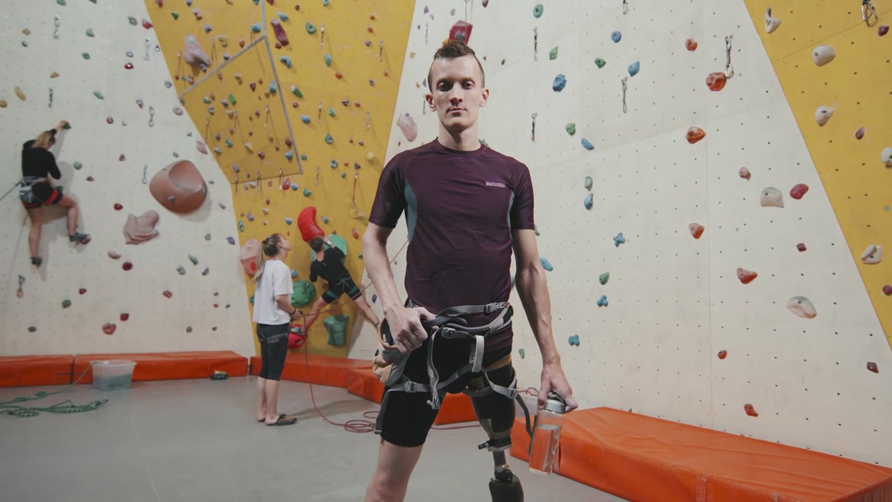 Man With Prosthetic Leg at Climbing Wall