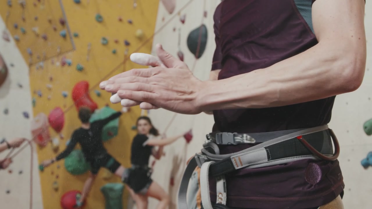 Climber Applying Chalk to Hands