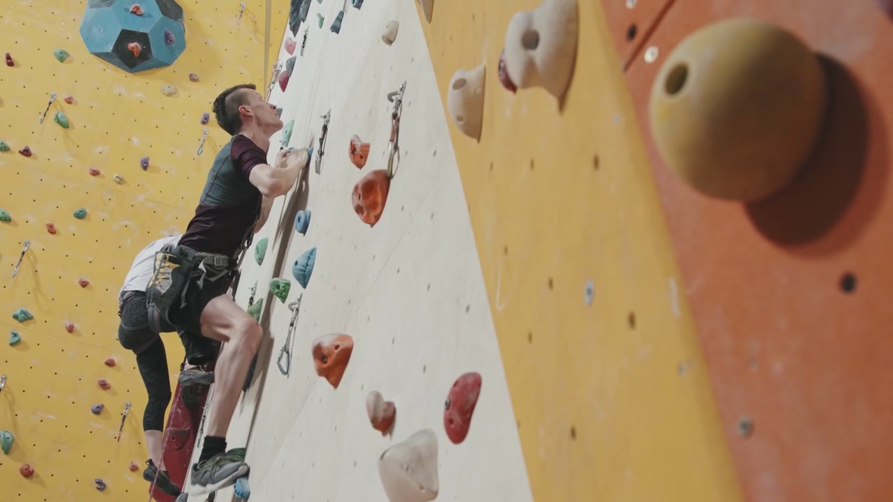 Man with Prosthetic Leg Climbs Rock Wall