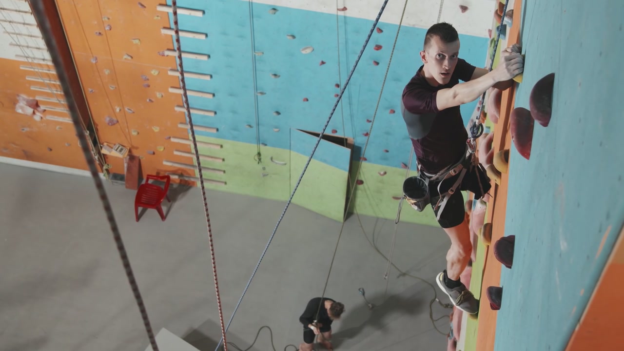 Man Rock Climbing Indoor Wall