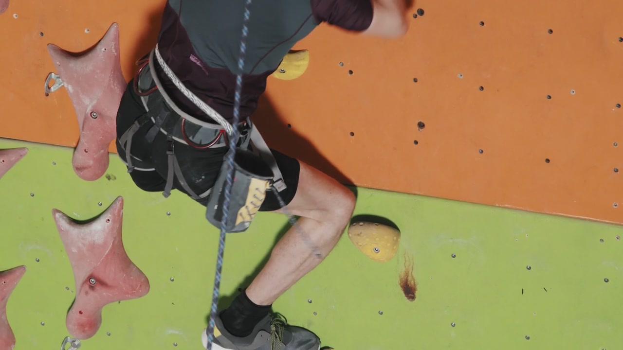 Man Climbing Indoor Rock Wall