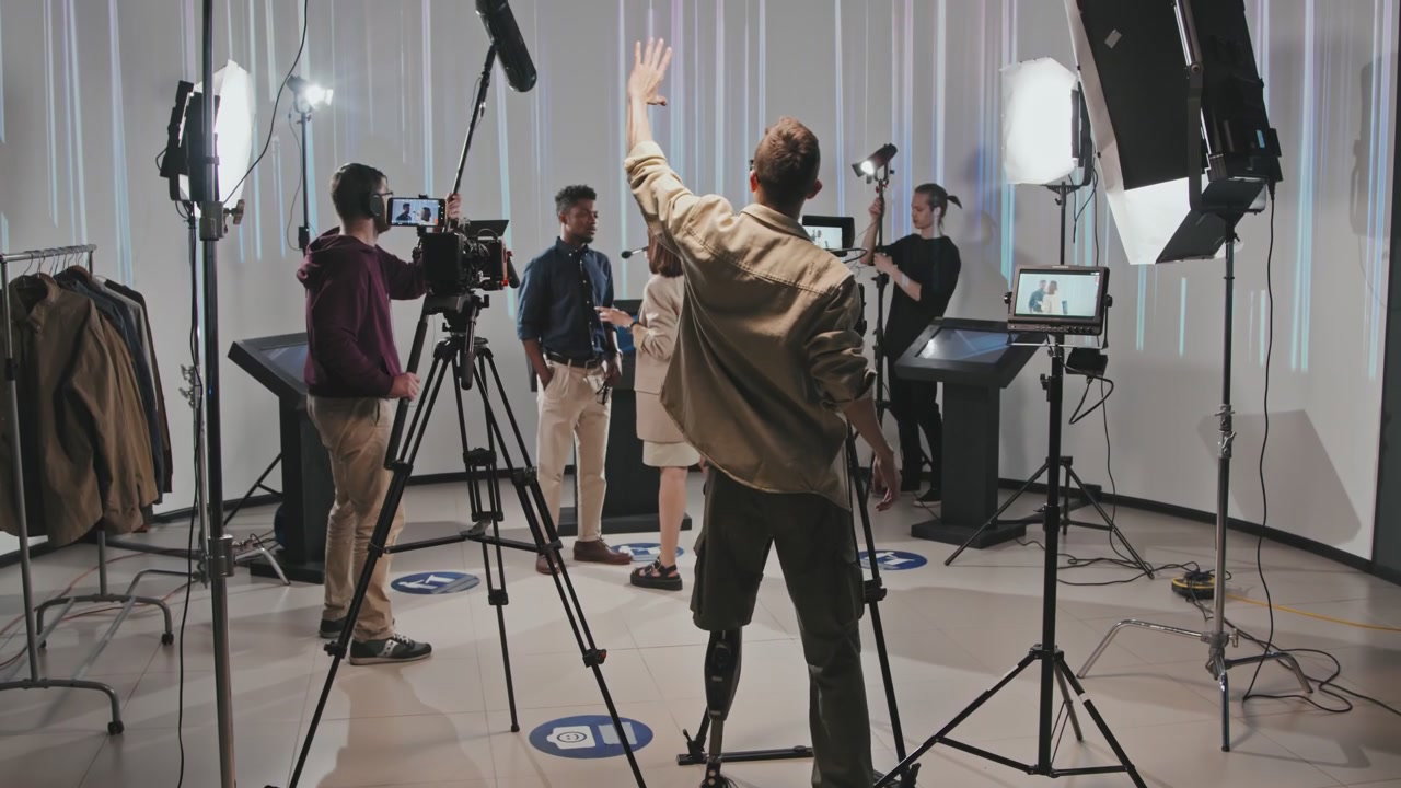 Filmmaker Directing Production Crew in Studio