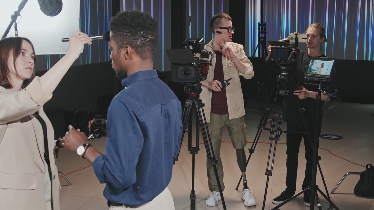 Cameraman with Prosthetic Leg in Film Studio