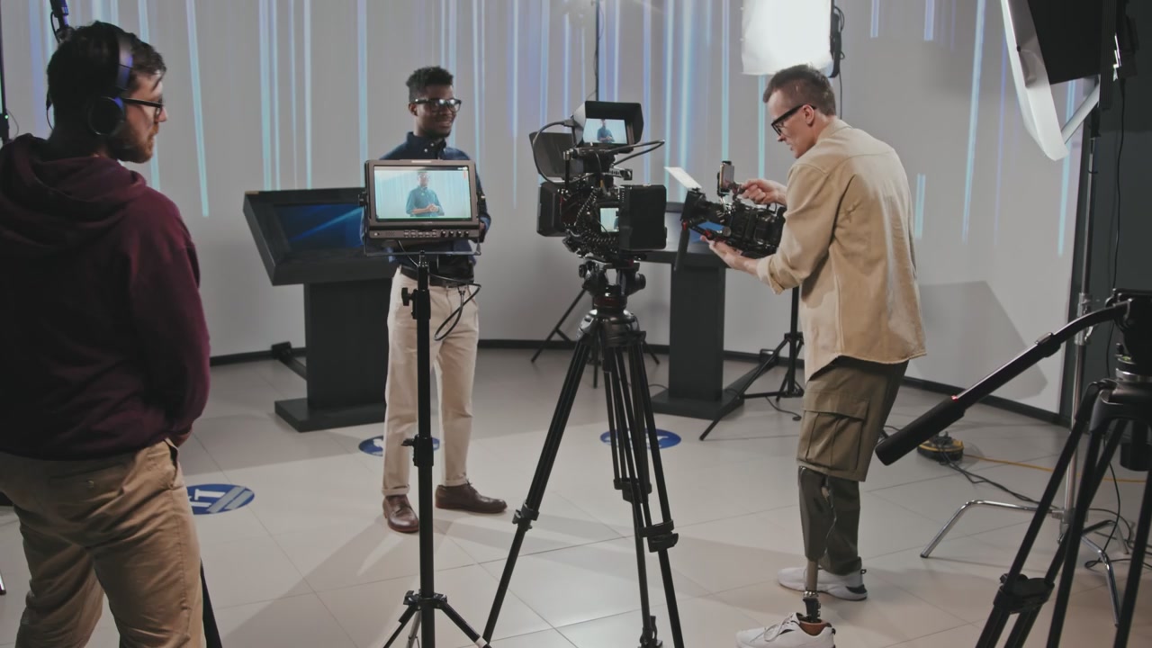 Film Crew Working on Set with Presenter