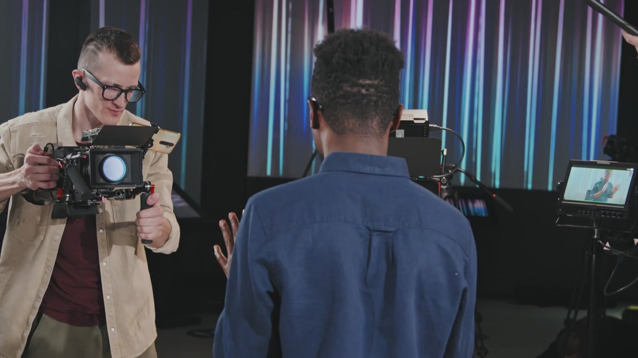 Cameraman Films Presenter on Studio Set