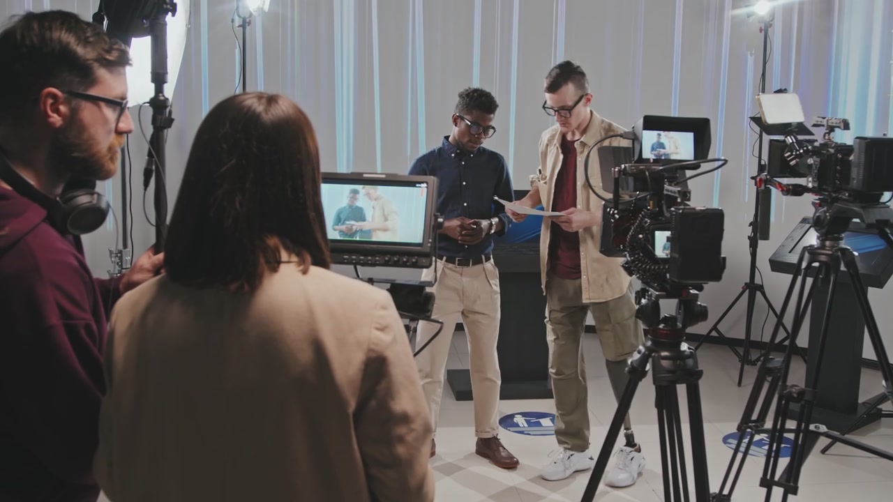 Film Crew Working With Man With Prosthetic Leg