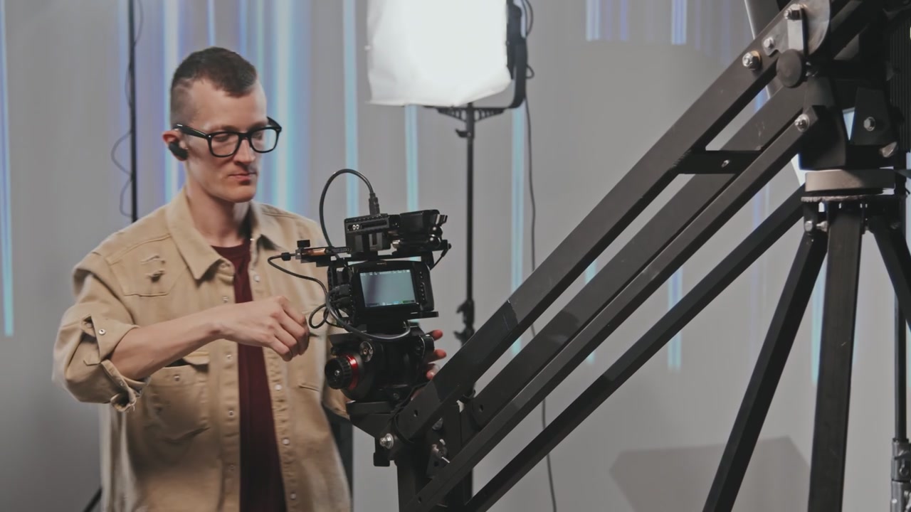 Cameraman Setting Up Studio Camera