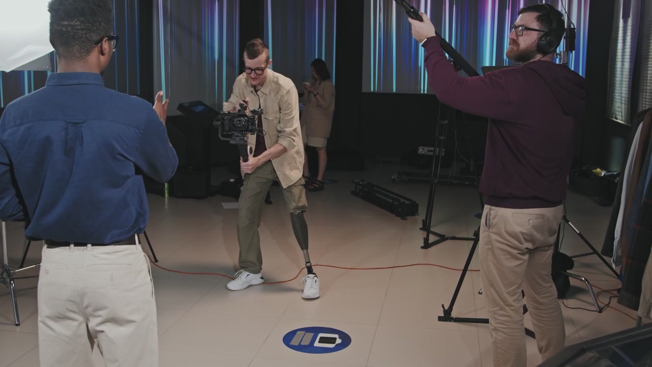 Cameraman with Prosthetic Leg on Film Set
