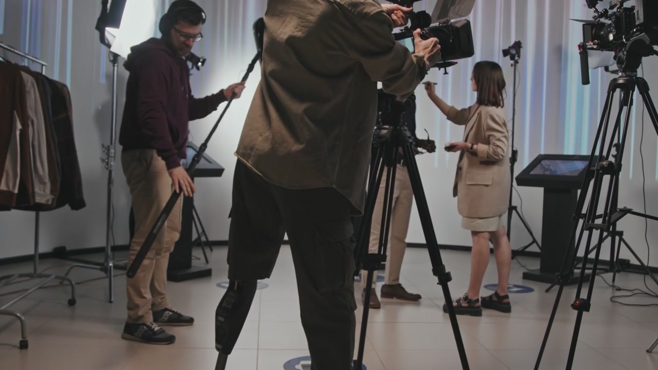 Cameraman with Prosthetic Leg on Film Set