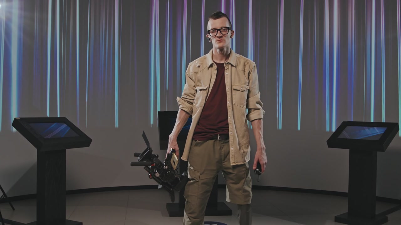 Cameraman with Prosthetic Leg in Studio
