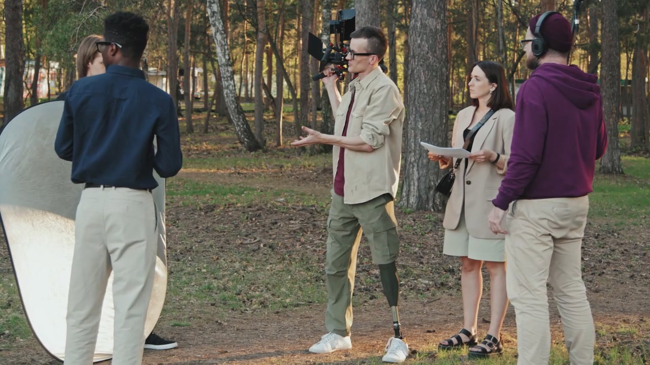 Film Crew Planning Shoot In Forest