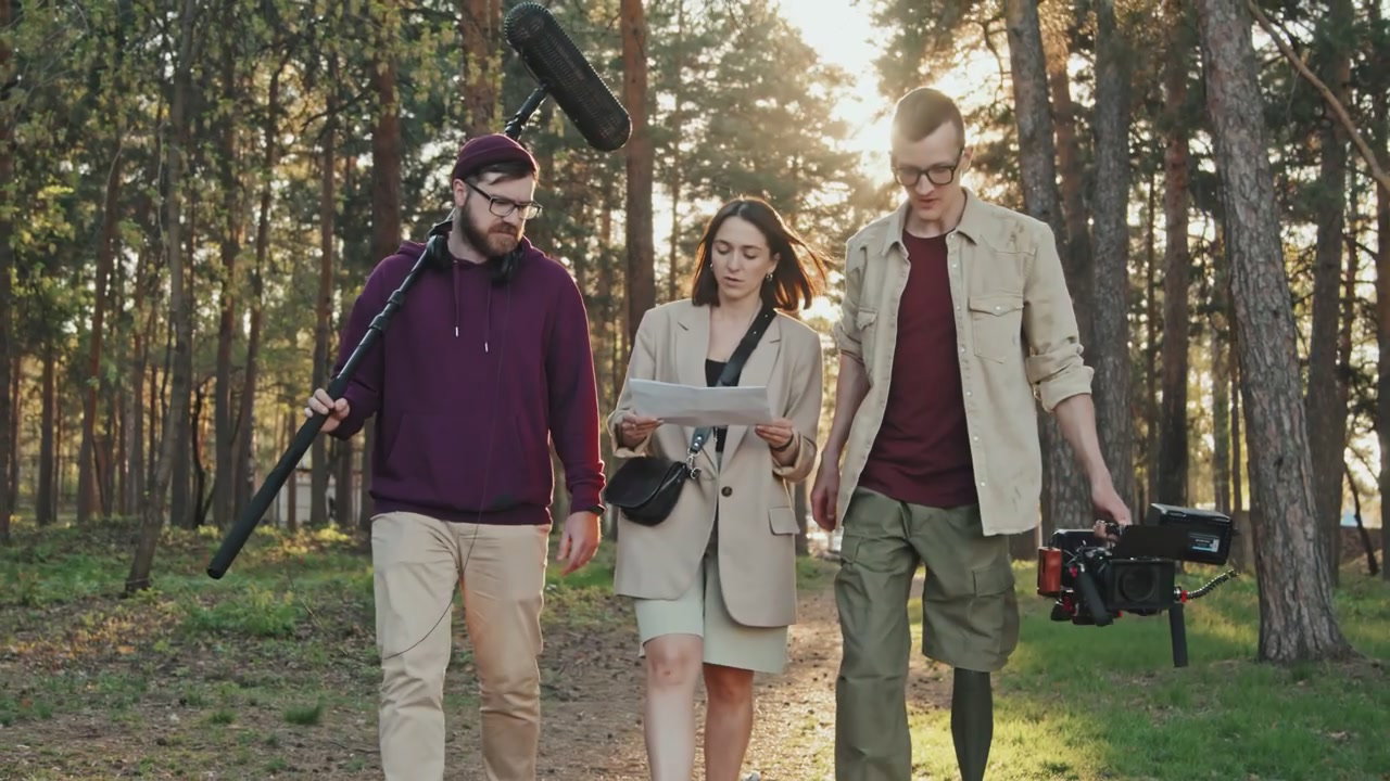 Film Crew With Prosthetic Leg Discussing Script