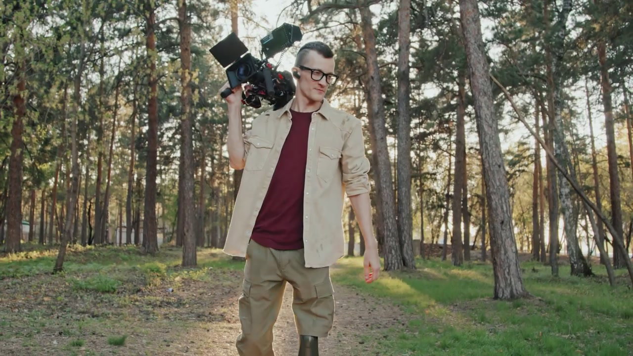 Man with Prosthetic Leg Carrying Camera in Forest