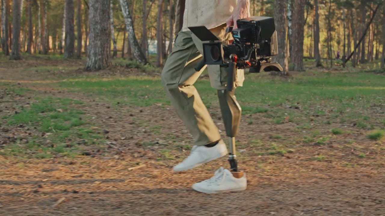 Filmmaker With Prosthetic Leg Walks Through Forest