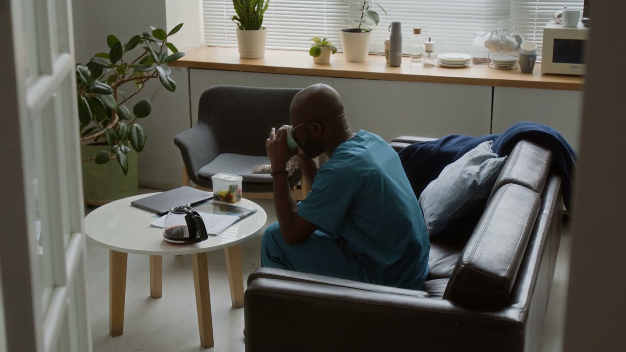 Doctor on Coffee Break in Staff Lounge