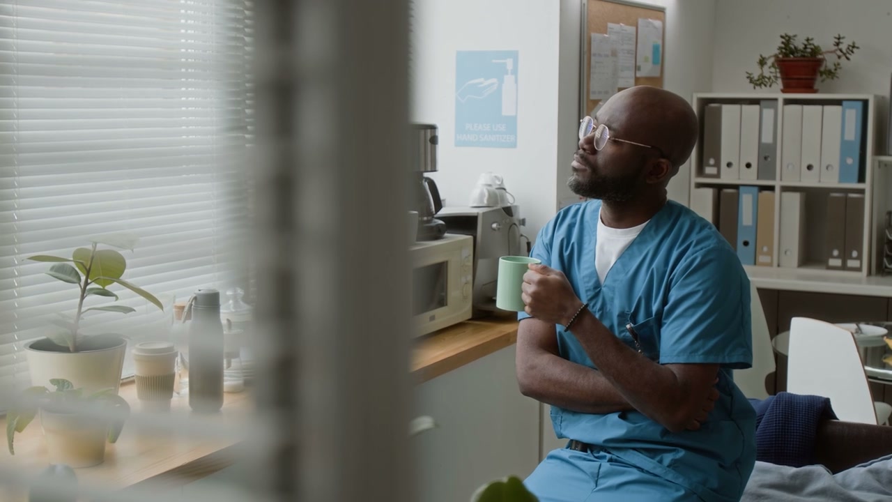 Doctor Taking Coffee Break in Office