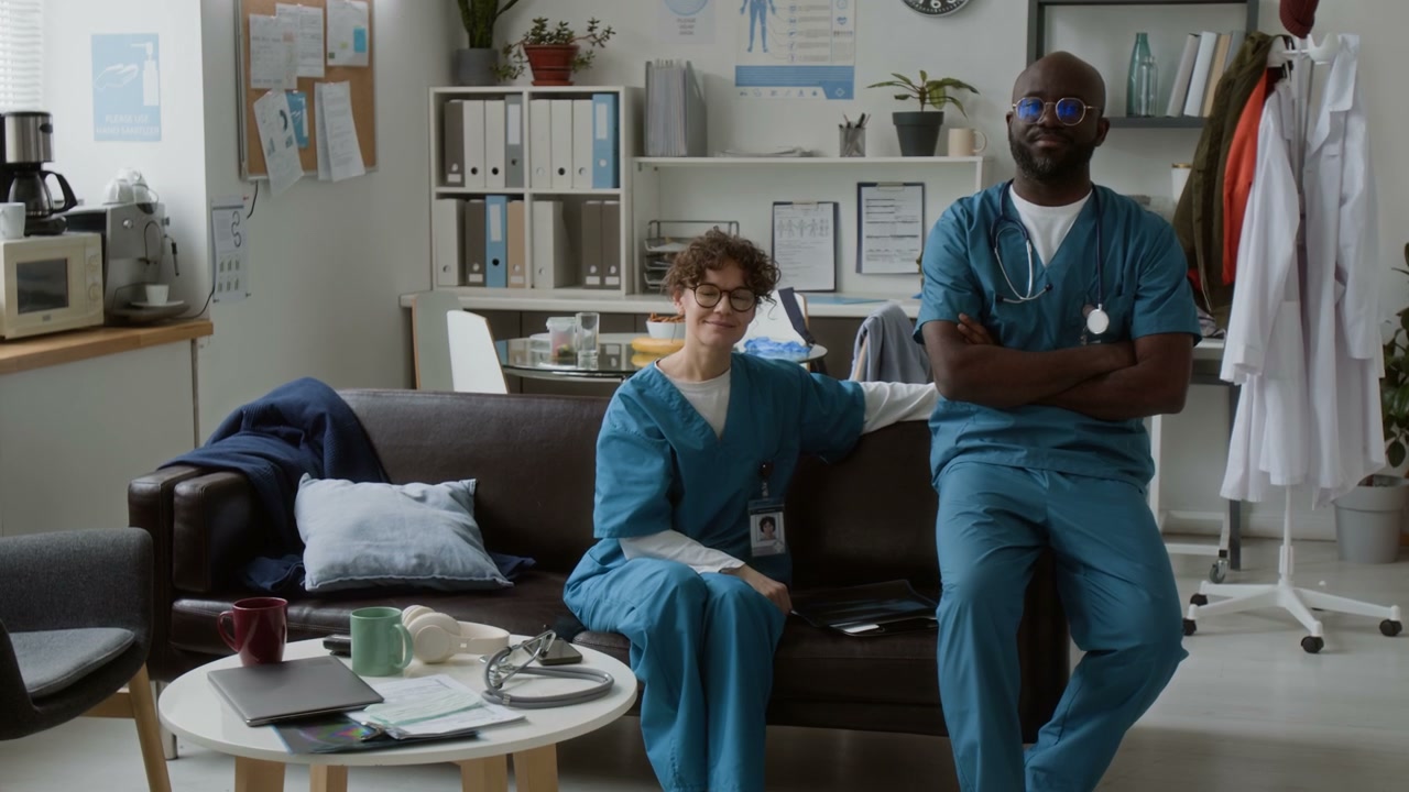 Diverse Medical Professionals Smiling in Break Room