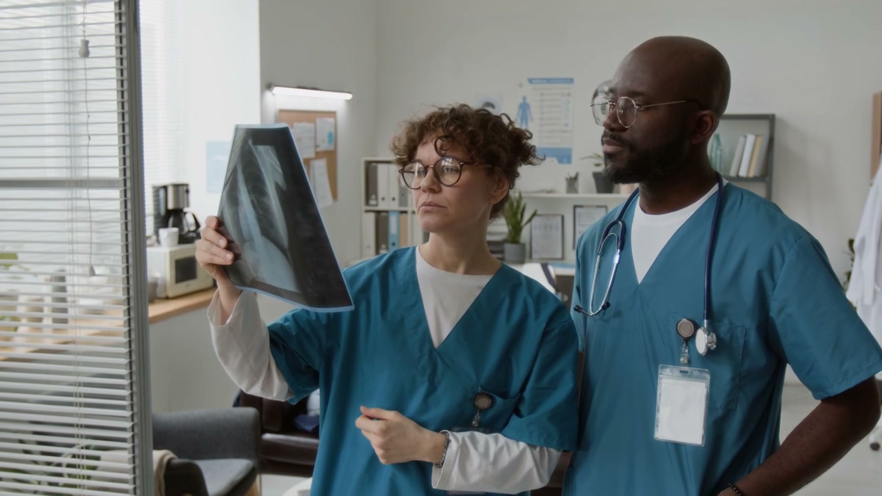 Doctors Discussing X-Ray Scan