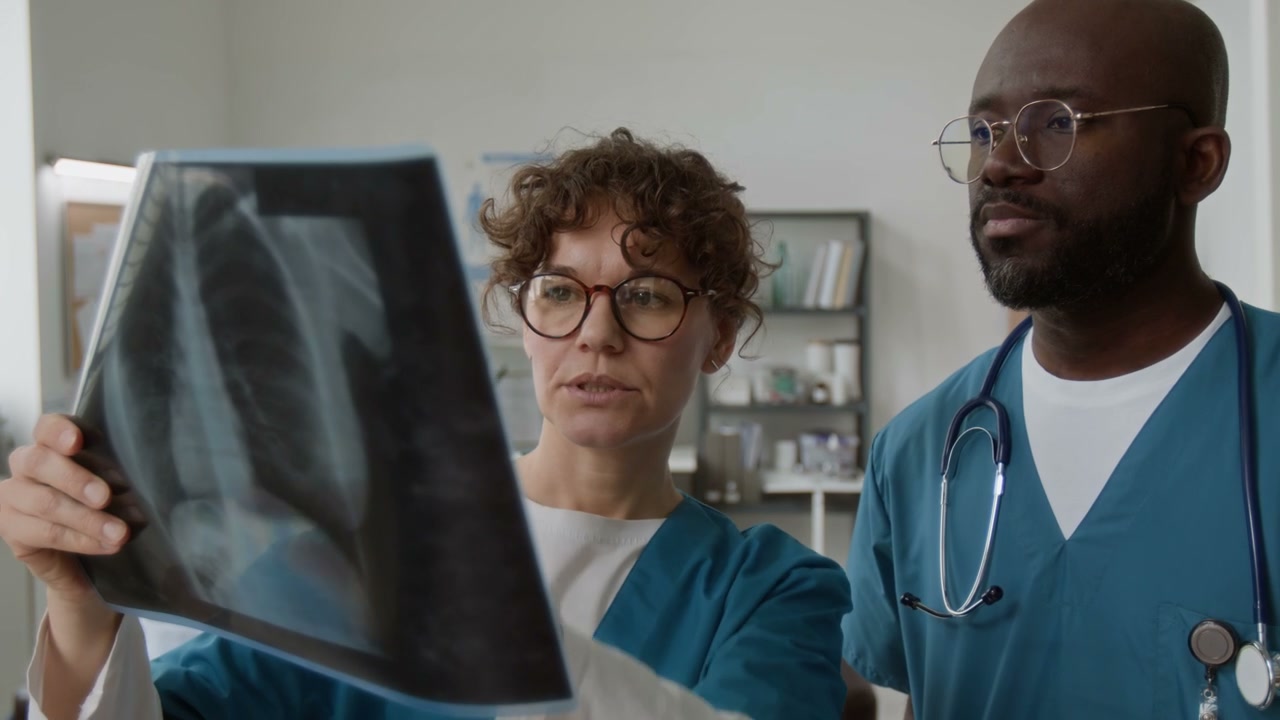Medical Team Discussing X-Ray