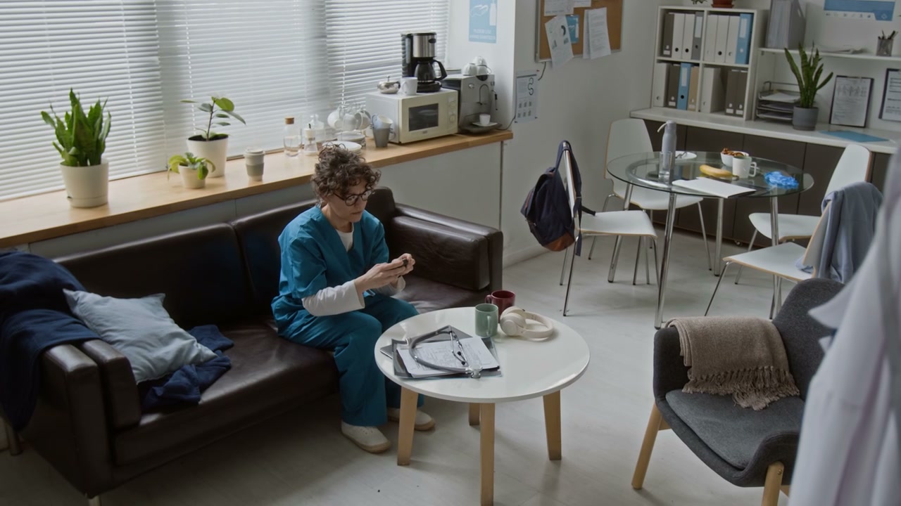 Doctor Gets Ready in Clinic Break Room