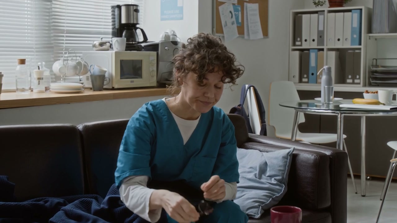 Doctor Waking Up and Stretching in Break Room