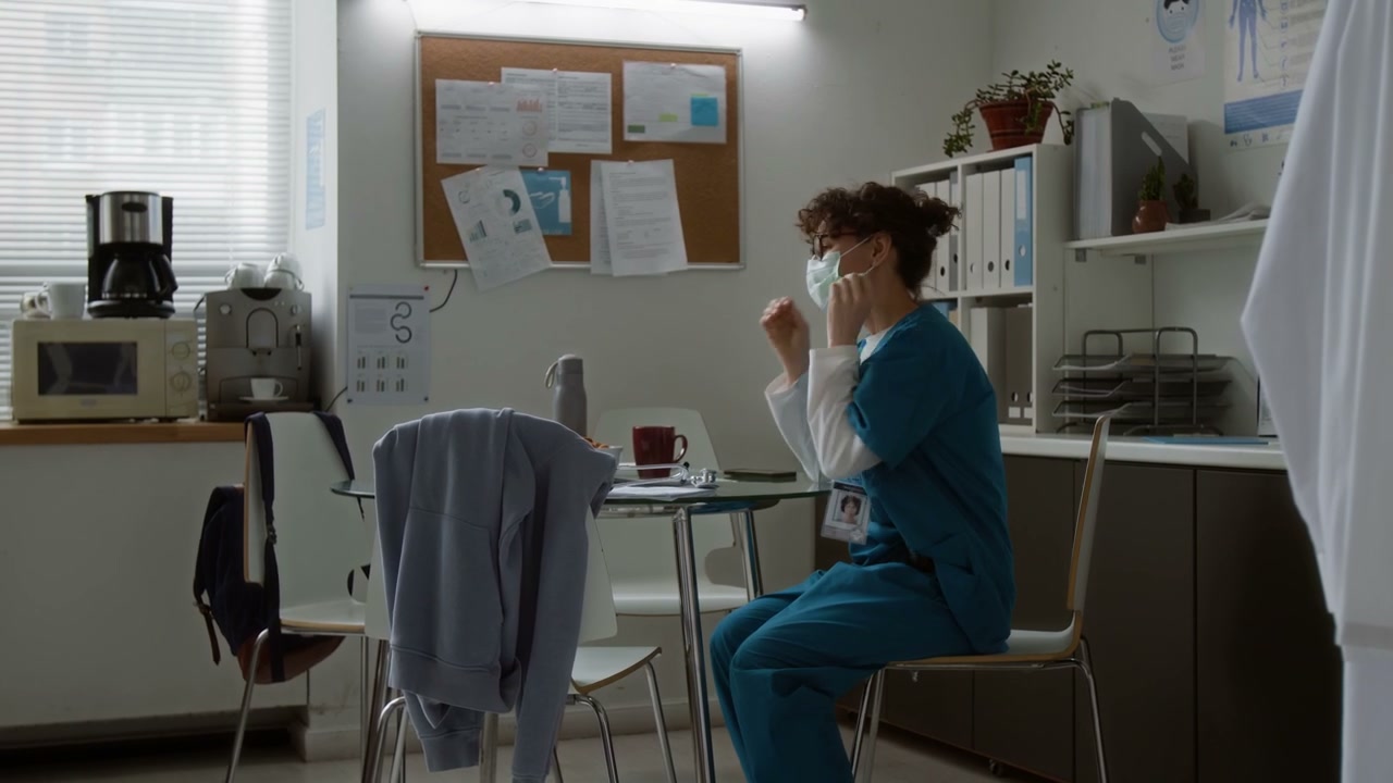 Tired Healthcare Worker in Break Room