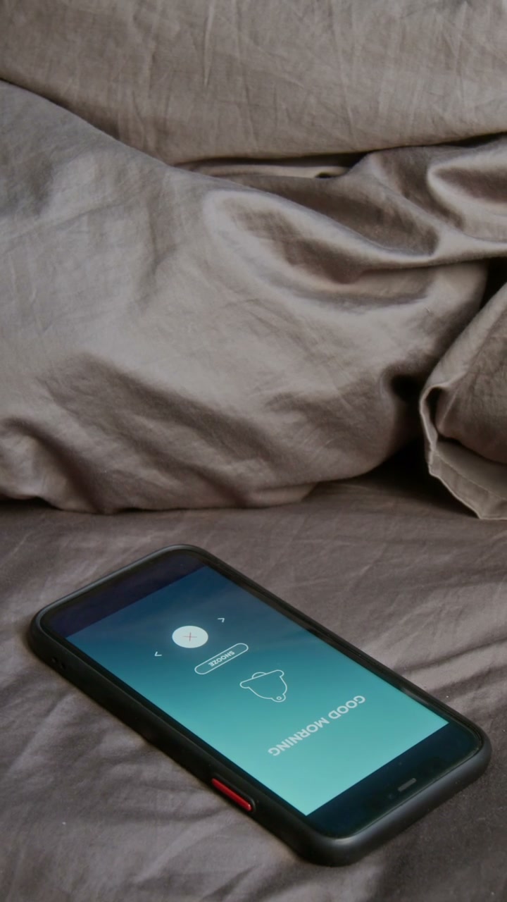 Phone Alarm Rings on Bed